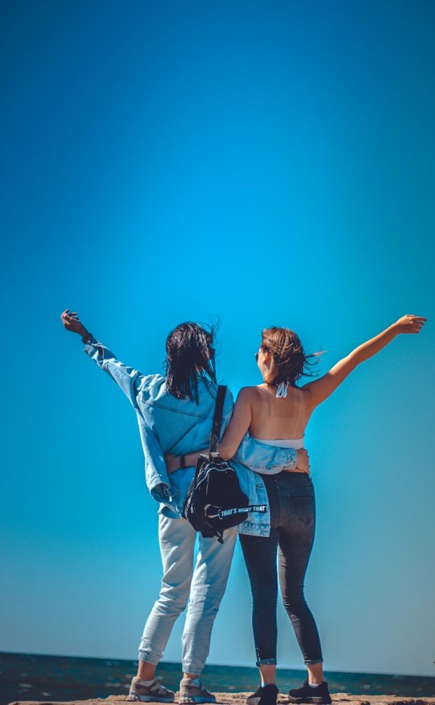 a couple of women holding hands